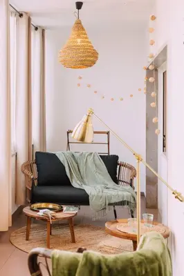 a living room with a black couch and a table at Starry Nights Apartment in Albufeira