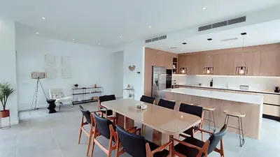 a kitchen with a table and chairs in a room at Valverde 3 Villa, Vilamoura, Algarve, only 5 minutes from Marina, Golf and Beach in Quarteira