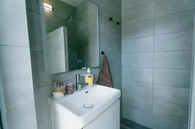 a bathroom with a shower with a toilet and a sink at Casas Caiado Two Houses with swimming POOL in Faro