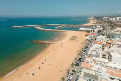 an aerial view of a beach and the ocean at Orange Boutique Residence - Casa Luis Camões in Quarteira