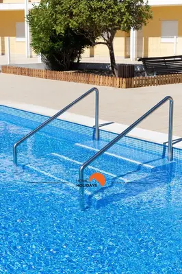 a swimming pool with a volley ball in the water at #123 T2 Pão das Areias by Home Holidays in Albufeira