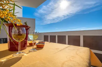 two glasses of white wine sitting on a table at AlgarSun - idealy situated holiday apartment with all modern comfort in Albufeira