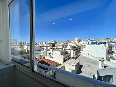 a view of a city from a window at Faro Deluxe by Homing in Faro
