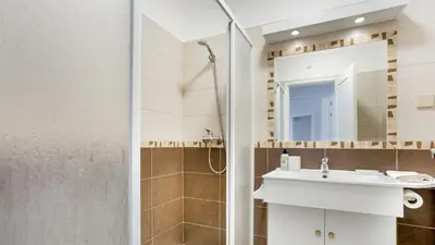 a bathroom with a sink and a shower at Sun-kissed Oasis W/ Pool by LovelyStay in Albufeira