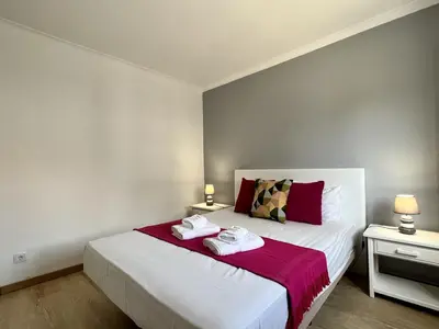 a bedroom with a bed with two towels on it at Vilamoura Central 5 by Homing in Vilamoura