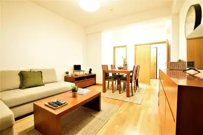 a living room with a couch and a table at Marina de Albufeira T2 até 6 pax Com Piscina e Vista Marina in Albufeira