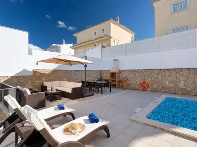 a patio with a swimming pool and a villa at Villa Mathilda by Interhome in Albufeira