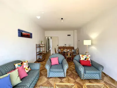 a living room with two couches and a table at Vilamoura Palm Tree With Pool by Homing in Vilamoura