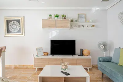 a living room with a tv and a couch at BeGuest Falésia Pine & Sun Apartment in Albufeira