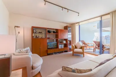 a living room with a couch and a tv at Apartamento Valerie in Vilamoura