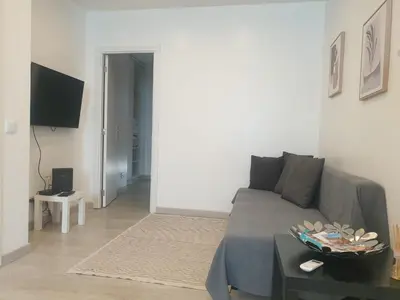 a living room with a couch and a table at Faro Casa da Baixa in Faro