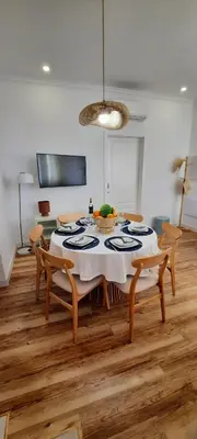 a dining room with a table and chairs at Casa da Açoteia - Bright City Center Apartment with a Private Outdoor Terrace in Faro