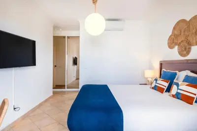 a bathroom with a shower and a sink and a toilet at Clube Albufeira: 2BR Prime Holidays Retreat in Albufeira