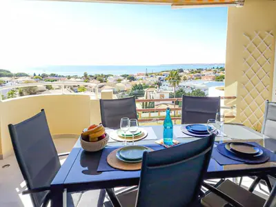 a blue table and chairs on a balcony with a view at MarGalé - Swimming Pool - Beach - BY BEDZY in Galé