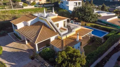 an overhead view of a large white house with a swimming pool at Villa Savannah - Close to fisherman beach in Albufeira