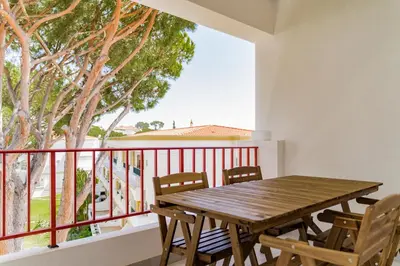 a white wall with a basket and a plant at Melvin Jones St. 2bedroom apartment in Quarteira