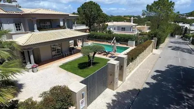 an aerial view of a house with a swimming pool at Villa Selena - Beautiful Luxury villa with massage baths in Quinta do Lago