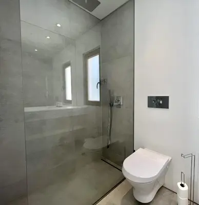 a bathroom with a shower and a toilet at Vila Ruby - Private Pool by HD PROPERTIES in Vilamoura