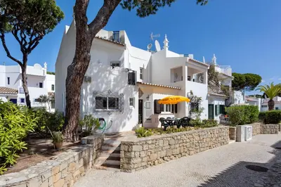 a living room with a couch and a table at Villa Isabel in Vale do Lobo