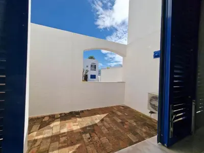 an empty room with a window in a white wall at douceur d'algarve in Albufeira