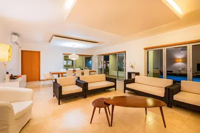 a living room with couches and a table at Villa L in Galé
