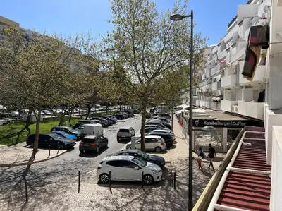 a group of cars parked in a parking lot at Casa Girassol Old Town in Albufeira