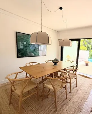 a dining room with a wooden table and chairs at Quinta do Lago, Victory Village N 63 in Almancil