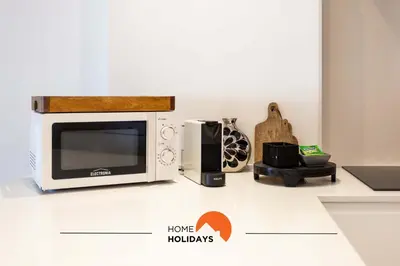 a microwave oven sitting on top of a counter at #126 T1 Vale Mangude 213 by Home Holidays in Albufeira