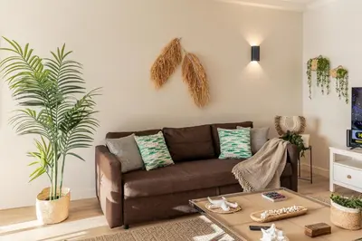 a room with two hanging baskets on the wall at Apartamento do Atlantico in Albufeira