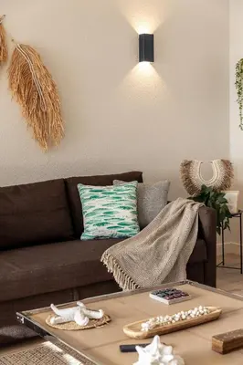 a living room with a table with a mirror at Apartamento do Atlantico in Albufeira