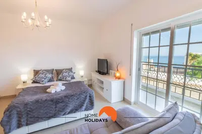 a bathroom with two bottles of shampoo and a sink at #108 T0 Coronel Águas by Home Holidays in Albufeira