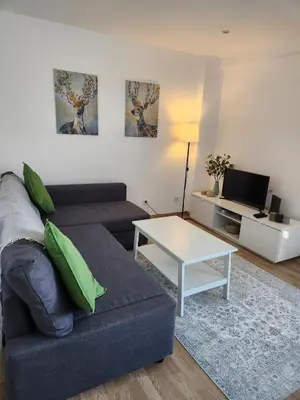 a living room with a couch and a table at GrowIN Stay Downtown in Faro