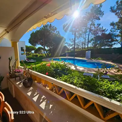 a patio with a swimming pool and a garden at PARADISE ON THE BEACH in Albufeira