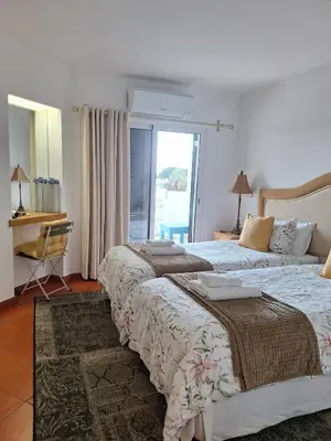two beds in a hotel room with a window at Piece of Paradise @ Balaia Golf Village, Albufeira, PORTUGAL - 4 STAR in Albufeira