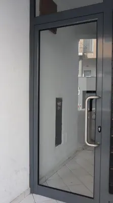 a glass door with a window in a building at MFA By Albufeira Rental in Albufeira