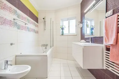 a bathroom with a tub and a sink at Villa Patio in Albufeira