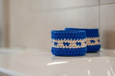 two blue baskets sitting on top of a counter at Sunny Albufeira - 5min to the beach by LovelyStay in Albufeira