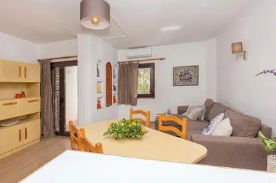 a living room with a table and a couch at Apartment Maresia in Albufeira