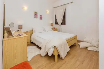 a bedroom with a bed and a desk and a mirror at Apartment Maresia in Albufeira