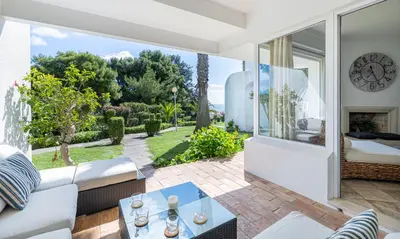 a living room with a couch and a table at LongLands Peak at Windmill Hill in Albufeira