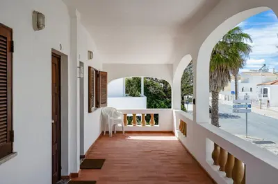 a hallway with a table and chairs in a house at Bright Albufeira - 5min to the beach by LovelyStay in Albufeira