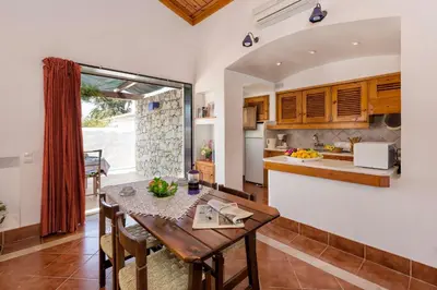 a dining room with a table at Villa Jacaranda in Albufeira