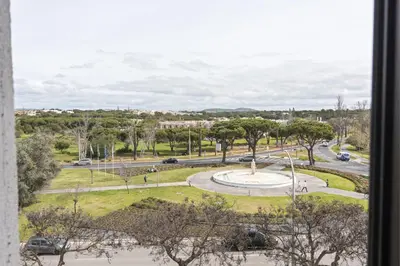 a view of a park from a window at Scandic - City Center by HD Properties in Vilamoura