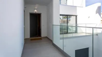 a hallway with glass shelves and a black door at Dream Apartment W/Pool & Balcony by LovelyStay in Albufeira