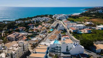 an aerial view of a city with the ocean at Dream Apartment W/Pool & Balcony by LovelyStay in Albufeira