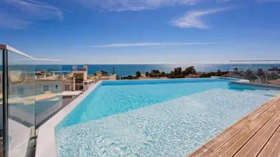 a swimming pool on top of a house with the ocean at Dream Apartment W/Pool & Balcony by LovelyStay in Albufeira