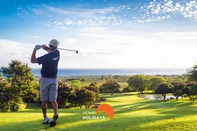 a man is playing golf on a golf course at #134 Vila Dias 2 by Home Holidays in Albufeira