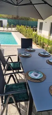 a blue table with chairs and a swimming pool at Valverde 2 Villa, Vilamoura, Algarve, only 5 minutes from Marina, Golf and Beach in Vilamoura