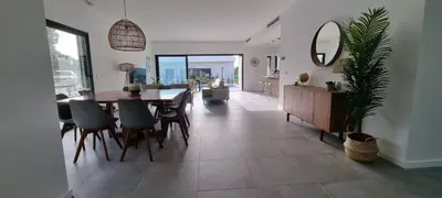 a dining room and living room with a table and chairs at Valverde 2 Villa, Vilamoura, Algarve, only 5 minutes from Marina, Golf and Beach in Vilamoura