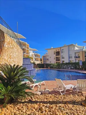 a swimming pool in front of a building at Luxury Condo in Top Complex with Ocean and Marina View by Be Cherish in Albufeira